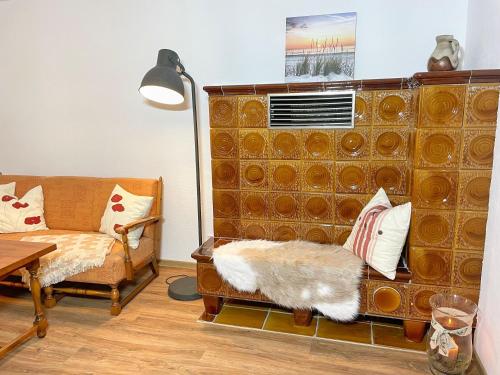 a living room with a couch and a table at Ferienwohnung Irmchen in Altefähr