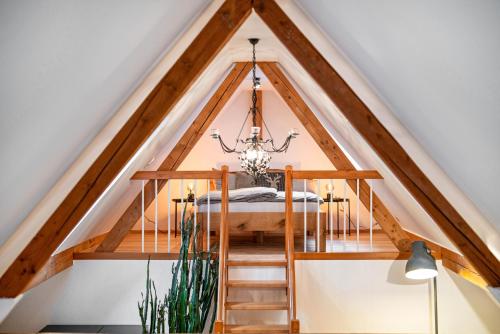 a room with a bed in the attic at Schwarzwaldmomente in Hornberg