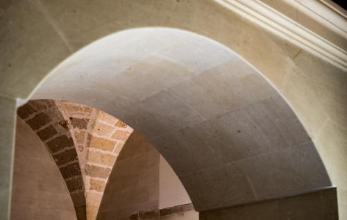 an archway in a building with a brick at La Fiermontina Luxury Home Hotel in Lecce