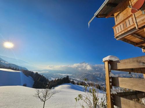 a view from a cabin in the snow at Ferienhaus Maria´s Hoamatl in Gallzein