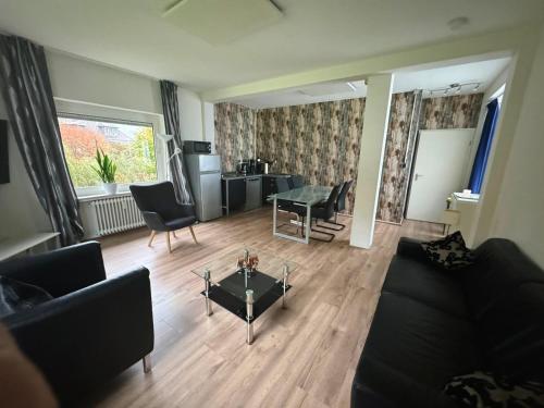 a living room with a couch and a table at Ferienhaus an der Saline in Bad Karlshafen