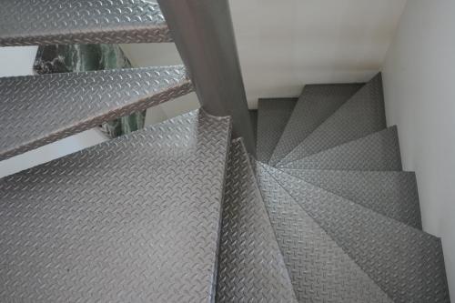a staircase with metal treads on a building at Tgna Lluria 11 in Tarragona