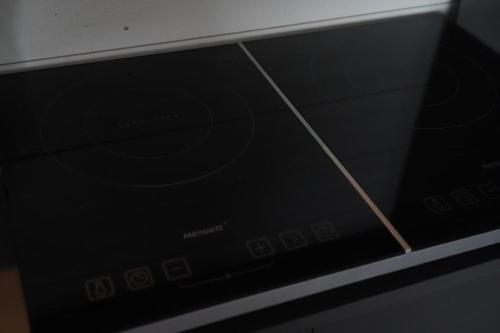 a close up of a microwave oven with its door open at Nybyggt -med spabad, bastu och nära stor badstrand in Kungsör