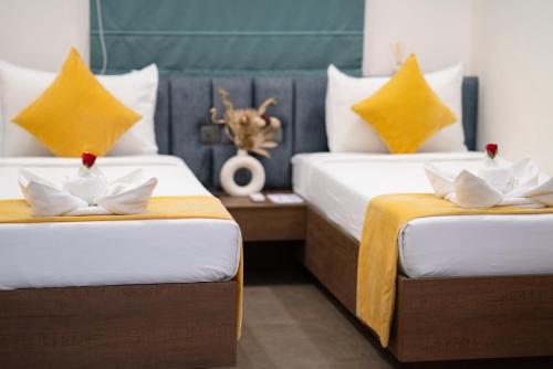 Una cama o camas en una habitación de Hotel Kyzen Smartstays - Smart, Reliable, Kyzen