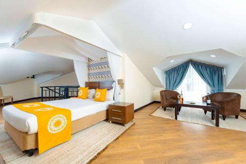 Heri Heights Hotel Apartments, SureStay Collection by Best Westernにあるベッド