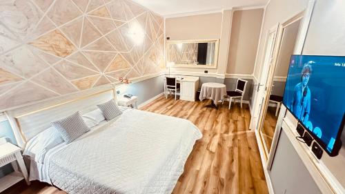 Μια τηλεόραση ή/και κέντρο ψυχαγωγίας στο Hotel Malpensa INN Aereoporto