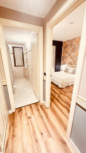 a room with a bed and a mirror at MOTEL Malpensa INN & Hotel-Airport in Tornavento