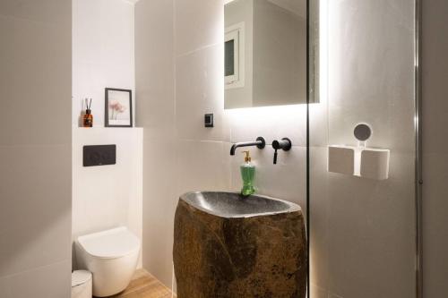 a bathroom with a sink and a toilet at 1BR Stylish Apt 20 Minutes from Acropolis in Athens