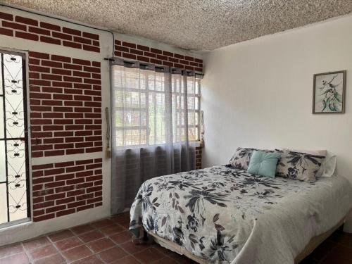 Postel nebo postele na pokoji v ubytování Little House Panajachel