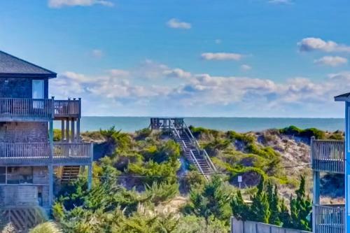 a view of the ocean from the balcony of a resort at Days to Remember in Avon