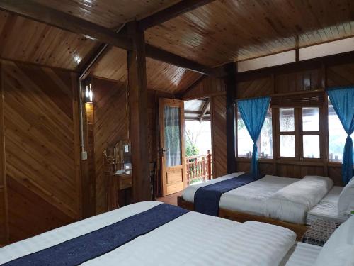 Postel nebo postele na pokoji v ubytování A Tu Homestay Muong Hoa