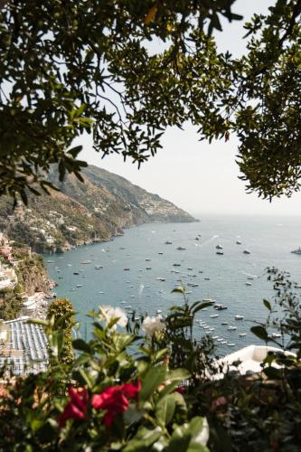 a view of a large body of water with boats at Villa Magia in Positano