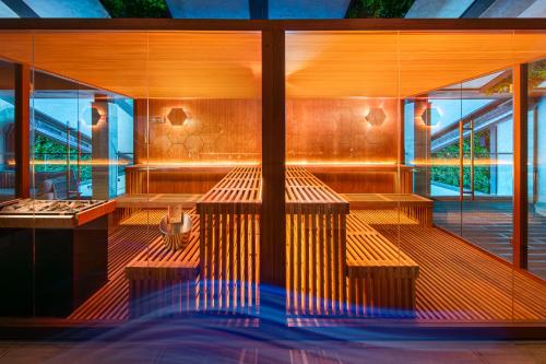 a row of benches in a room with windows at Boutique Complex Trakiets in Zhitnitsa