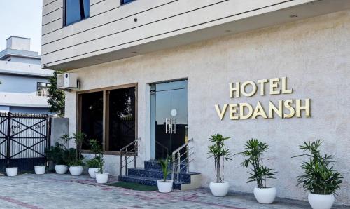 a hotel sign on the side of a building at Itsy Hotels Vedansh in Ludhiana