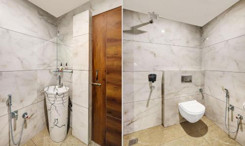 a bathroom with a toilet and a shower at Itsy Hotels Vedansh in Ludhiana