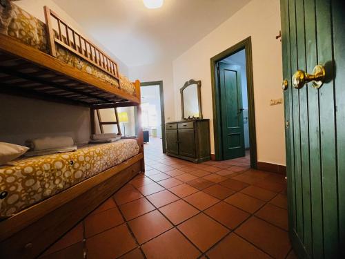 a room with two bunk beds and a mirror at Dornajo Dream By BlueTTravel in Sierra Nevada