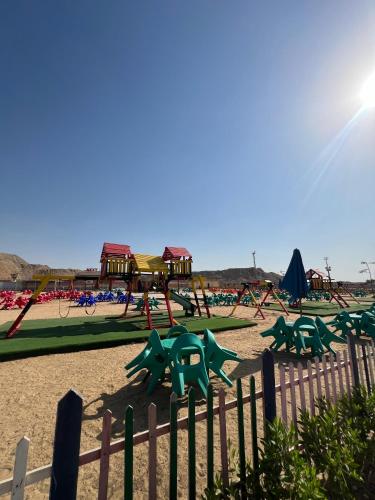 a park with a playground with slides and swings at Ramage Hotel & Resort in Cairo