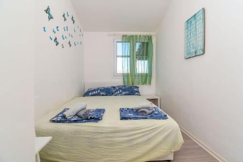 Postel nebo postele na pokoji v ubytování Apartment Denis
