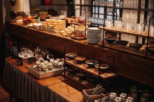 a buffet of food on display in a restaurant at Mill Apartments in Český Krumlov