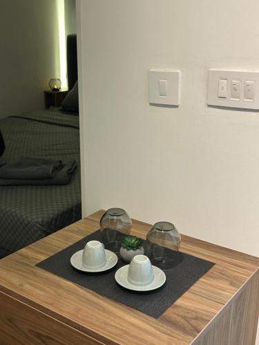 Příslušenství pro přípravu čaje a kávy v ubytování Seventh Oasis Apartment