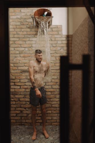 a man standing in front of a basketball hoop at Seaside Apartments Roja in Roja
