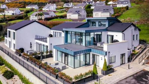 an aerial view of a large white house at BayView Luxury 4 Bedroom Penthouse in Downings