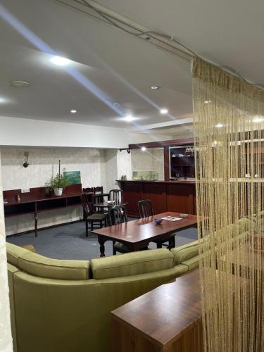 a dining room with a table and chairs at Abu Arena Hall in Baku