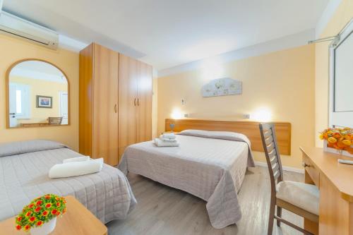 Posteľ alebo postele v izbe v ubytovaní Hotel Nuovo Belvedere