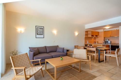 a living room with a couch and a table at Kaliakria Resort in Topola