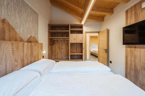 Postel nebo postele na pokoji v ubytování Residence Piz Aot
