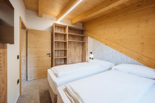 Postel nebo postele na pokoji v ubytování Residence Piz Aot