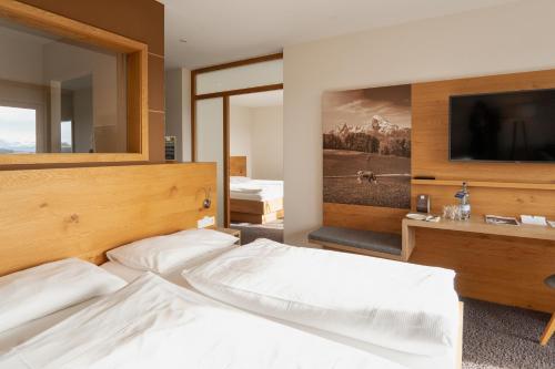 Uma cama ou camas num quarto em Das Weitblick Allgäu