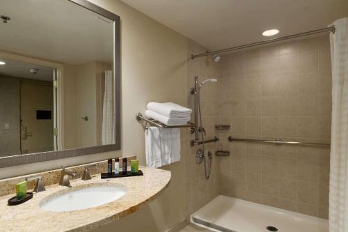 a bathroom with a sink and a shower at Embassy Suites by Hilton Philadelphia Valley Forge in Wayne