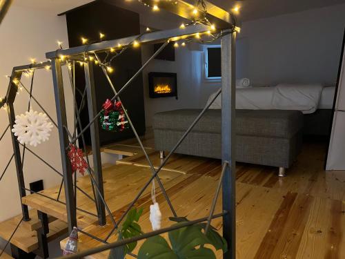 a living room with a bed and a group of lights at City Center Loft With Private Parking in Kavala
