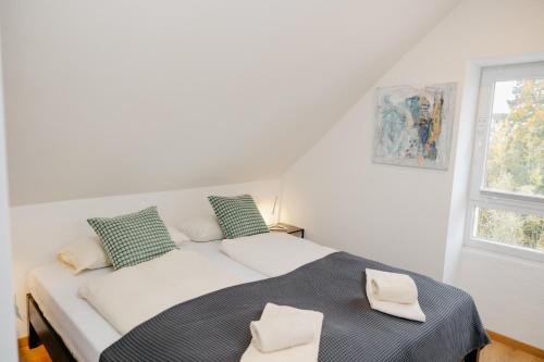 En eller flere senge i et værelse på nice2be Violet - Augsburg Zentrum