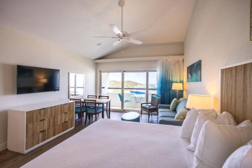 a living room with a couch and a table at Castle Villas at Bluebeards in Charlotte Amalie
