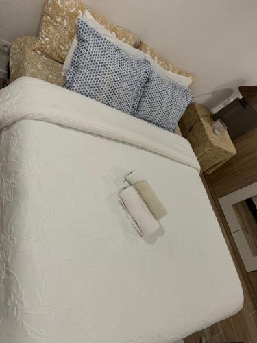Ένα ή περισσότερα κρεβάτια σε δωμάτιο στο Quarto aconchegante