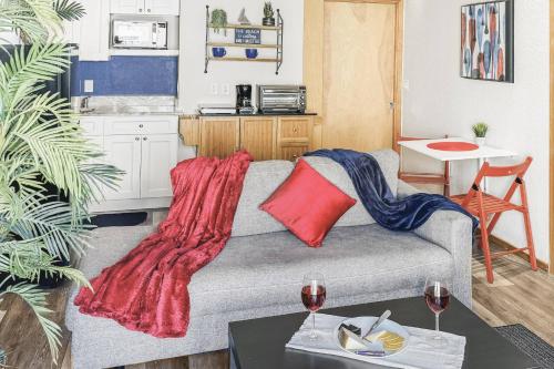 a living room with a couch with a blanket on it at 315B Drift Away | European Village in Palm Coast