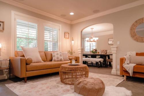 a living room with a couch and a table at Luxury House, Walk to Downtown or Pioneer Park in Nevada City