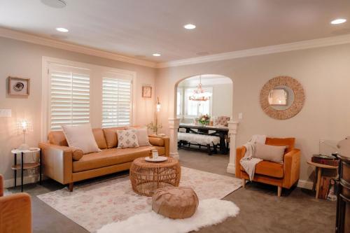 a living room with a couch and a table at Luxury House, Walk to Downtown or Pioneer Park in Nevada City
