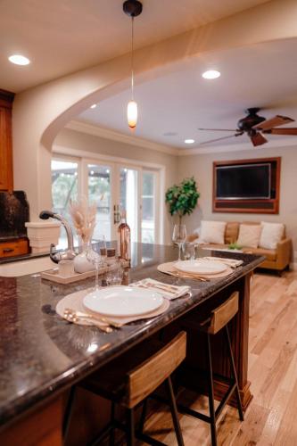 a kitchen with a large counter with two sinks at Luxury House, Walk to Downtown or Pioneer Park in Nevada City