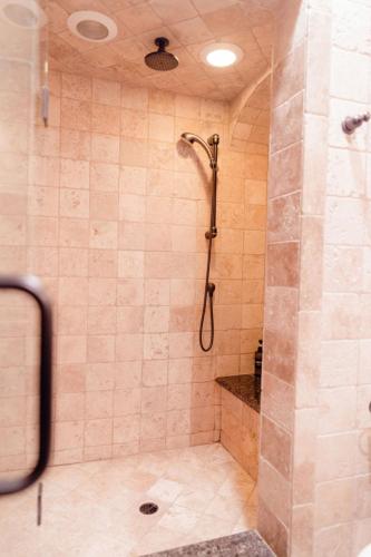 a bathroom with a shower with a glass door at Luxury House, Walk to Downtown or Pioneer Park in Nevada City