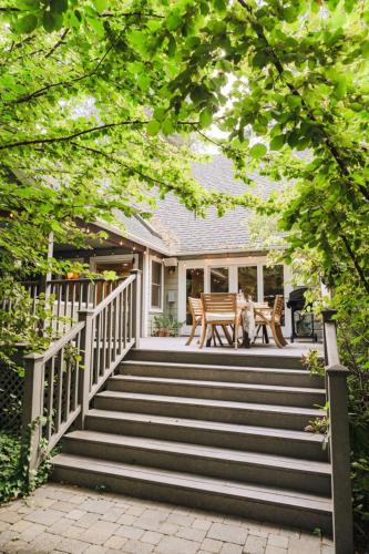 a dog sitting on the stairs of a house at Luxury House, Walk to Downtown or Pioneer Park in Nevada City