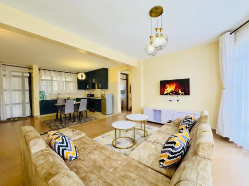 a living room with a couch and a table at Chill Spot in Nakuru