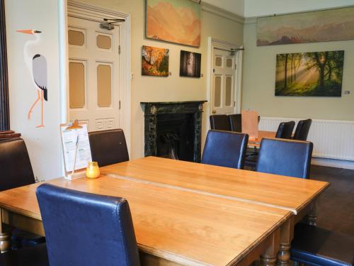 a conference room with a wooden table and chairs at YHA Hawkshead in Hawkshead