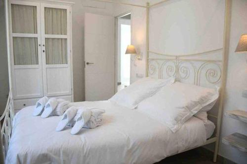 Ένα ή περισσότερα κρεβάτια σε δωμάτιο στο IX B Apartamentos Morales & Arnal