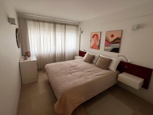 Ένα ή περισσότερα κρεβάτια σε δωμάτιο στο Apartamento Golden Sky
