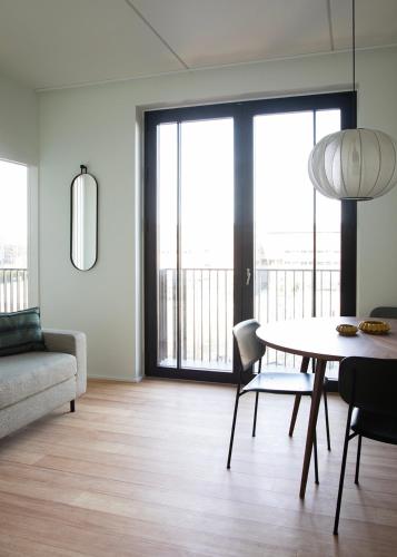 Ένα ή περισσότερα κρεβάτια σε δωμάτιο στο Nordhus Guest Apartments