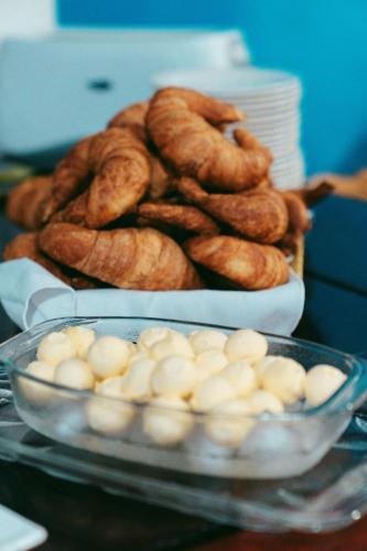 a pile of pretzels and a bowl of bread at Fernandina Hotel & Spa in Puerto Ayora