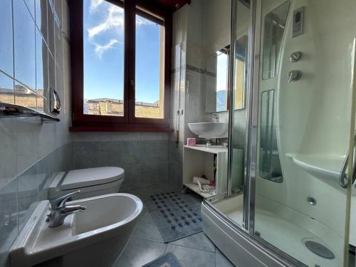 a bathroom with a sink toilet and a shower at Mini appartamento in Sondrio Centro in Sondrio